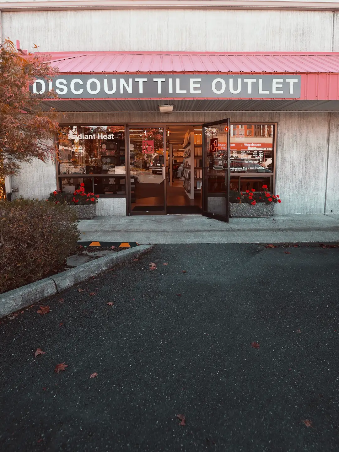 The Discount Tile Outlet storefront with the whole sign and the front door open